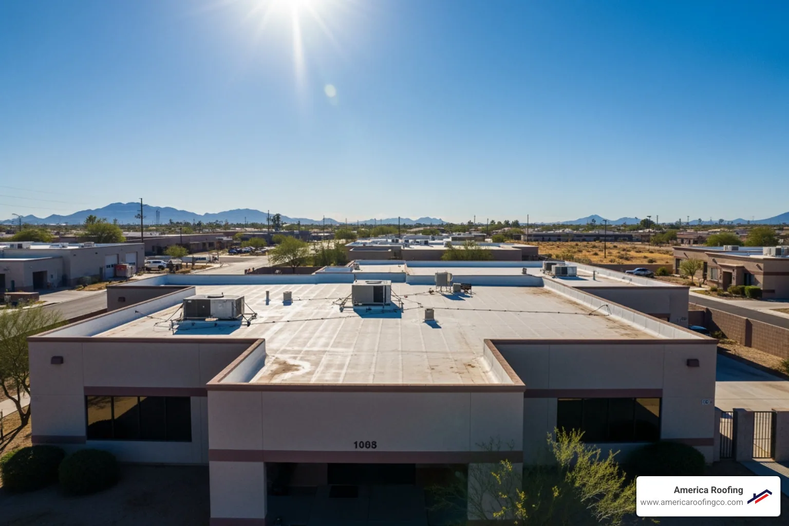 Drone performing a commercial roof inspection over a flat commercial roof in Arizona