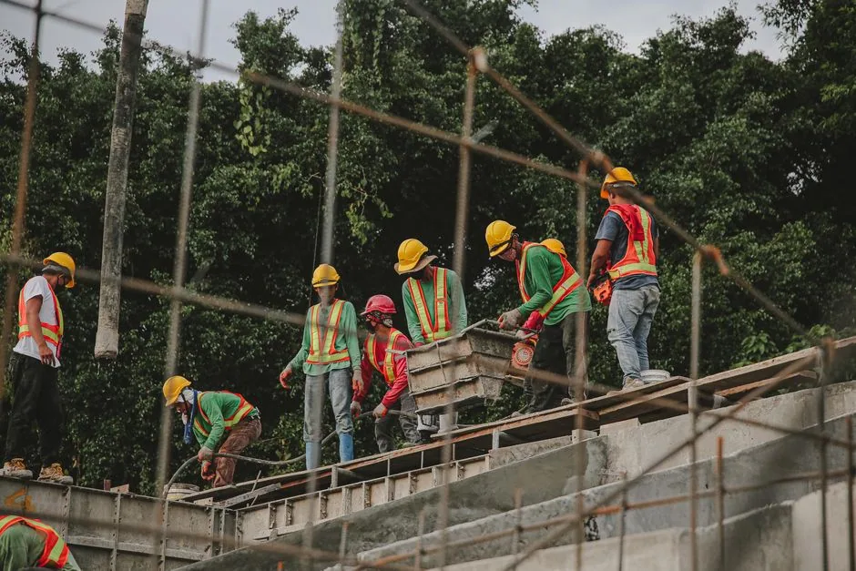 a professional roofing crew working safely on a roof - roof replacement