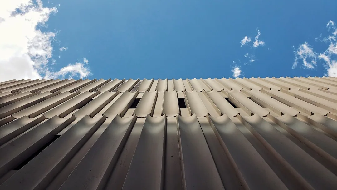 Professional installation of concrete tile roofing on a modern home in Mesa Arizona