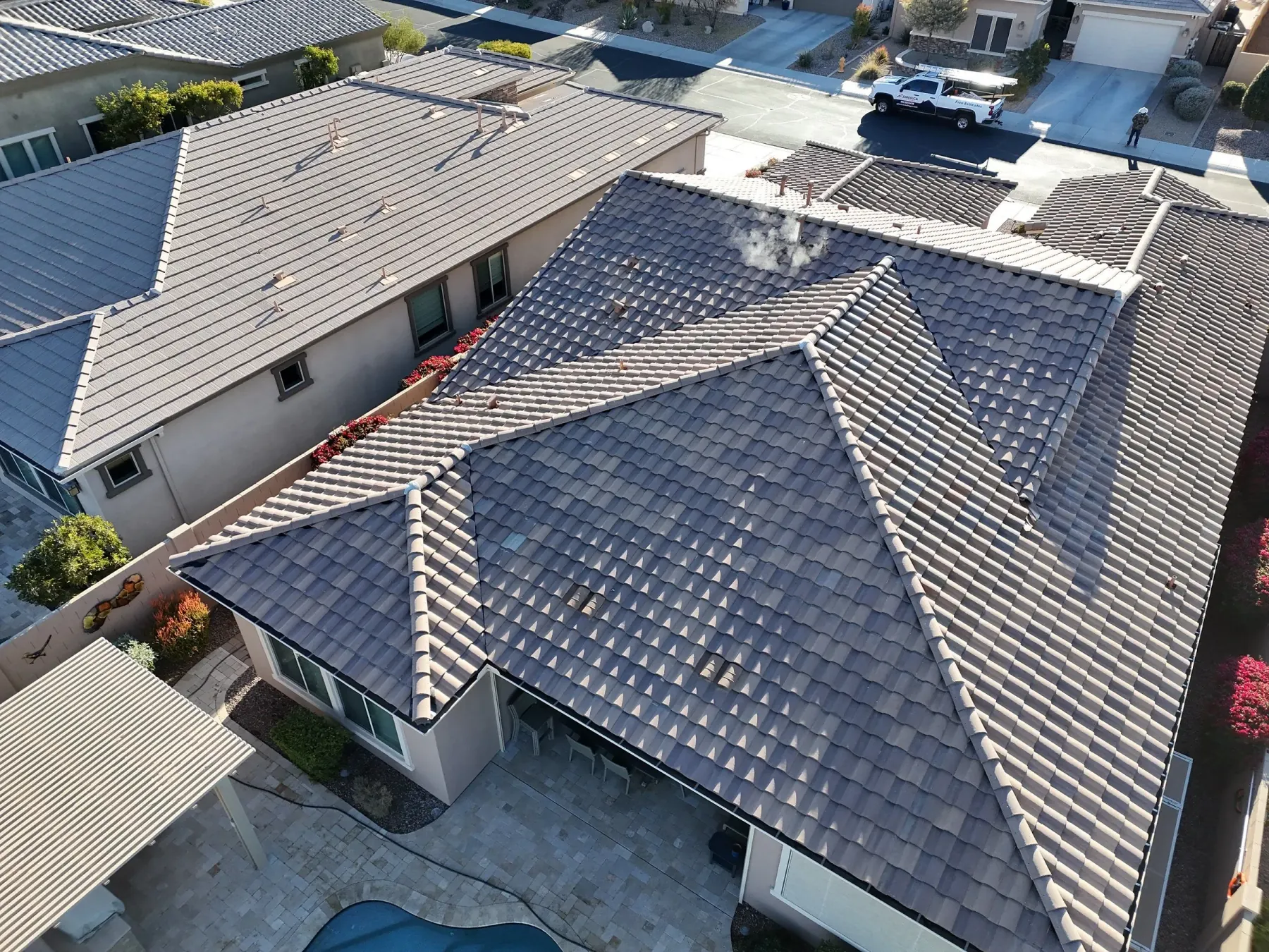 Finished dark gray tile roof viewed from above
